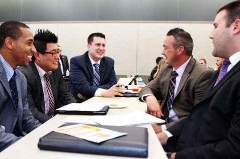 Men working happily while discussing different ideas