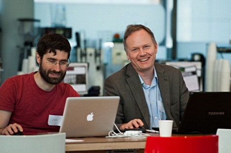 Two male employees working together