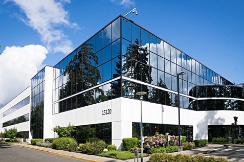 Company building surrounded with green plants