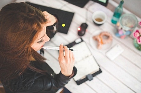 A woman thinking on something while working