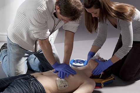 Man and woman conducting first aid training