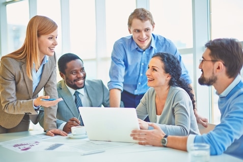 Happy employees discussing