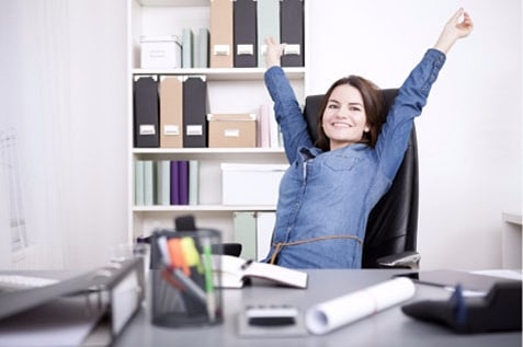 Happy female employee stretching her hands