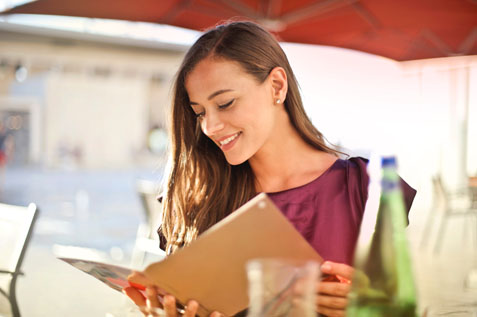 Lady looking at restaurant menu