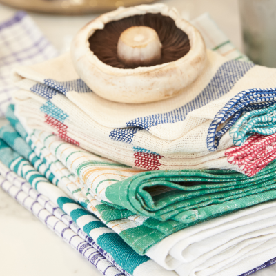 A stack of hygienically, cleaned Alsco tea towels and wipes in the kitchen